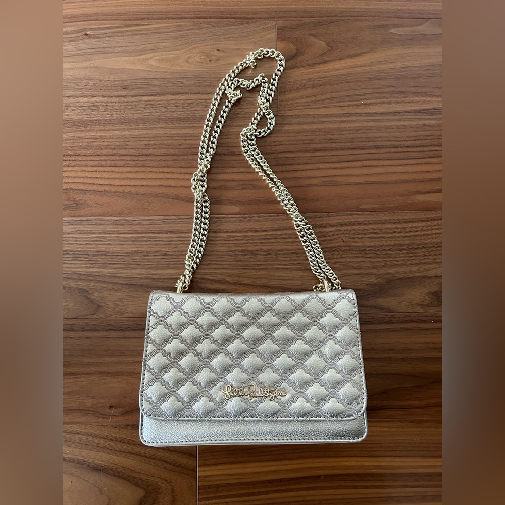 Lilly Pulitzer gold purse great to carry to dinner or lunch on  , worn twice